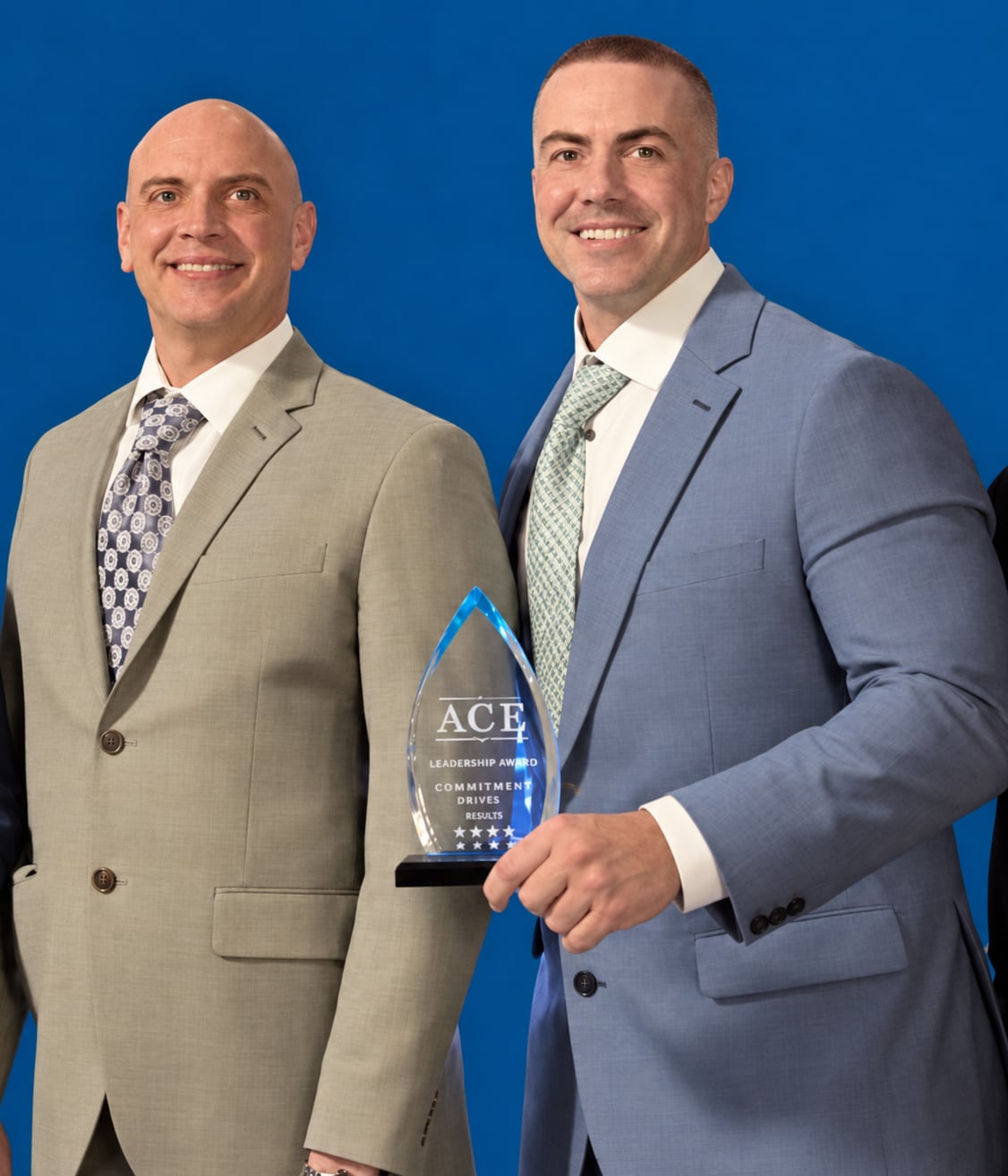 Kody Landals and Jeff Ramsden accepting the Phoenix Business Journal ACE Leadership Award for 2024 Innovator of the Year, earned at Reimagine Roofing, Jeff's previous company.